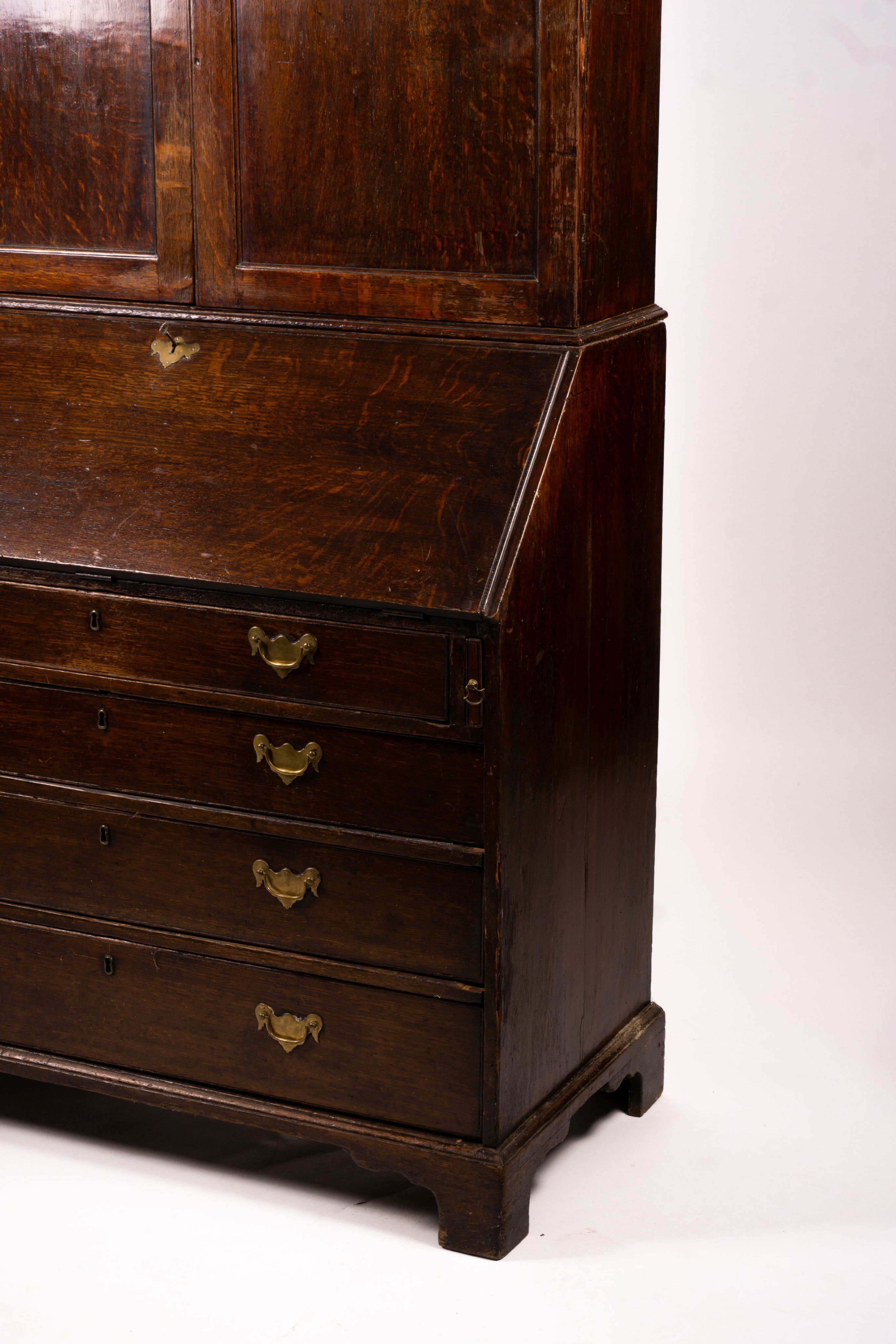 A George III oak bureau cabinet, width 108cm, depth 52cm, height 209cm